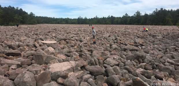 People in a boulder field in Pennsylvania.