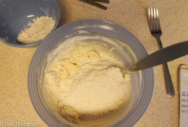 Photo of adding more ingredients inside a bowl to mix.