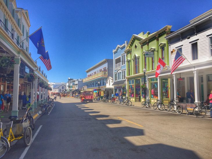 downtown Mackinac Island where the street is lined with colorful historic buildings that are now shops and restaurants