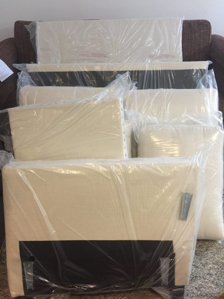 Stack of "build it yourself" furniture from overstock