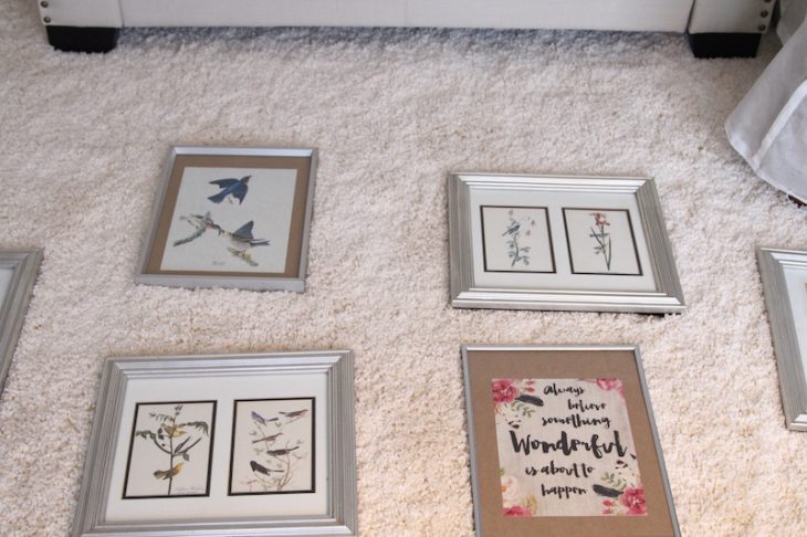 Laying the possible pieces of art on the floor in front of the wall helped determine the arrangement. Free artwork for walls for the win.