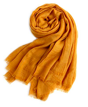 A photo of a golden light weight travel scarf.