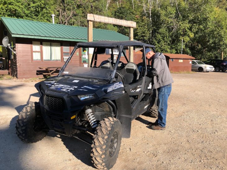 Alan standing next to UTV rented from Spearfish Canyon Lodge