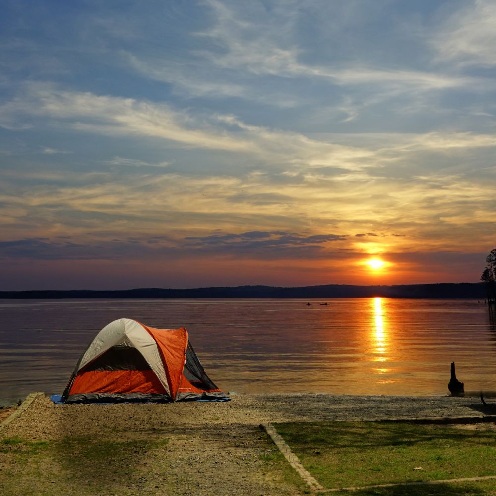 Orange tent with sunset, bets camping site.