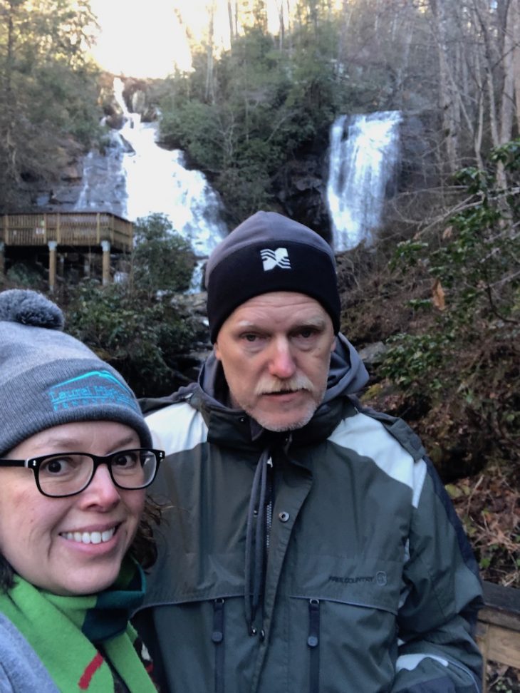 Picture of two people in front of the Anna Ruby Falls.