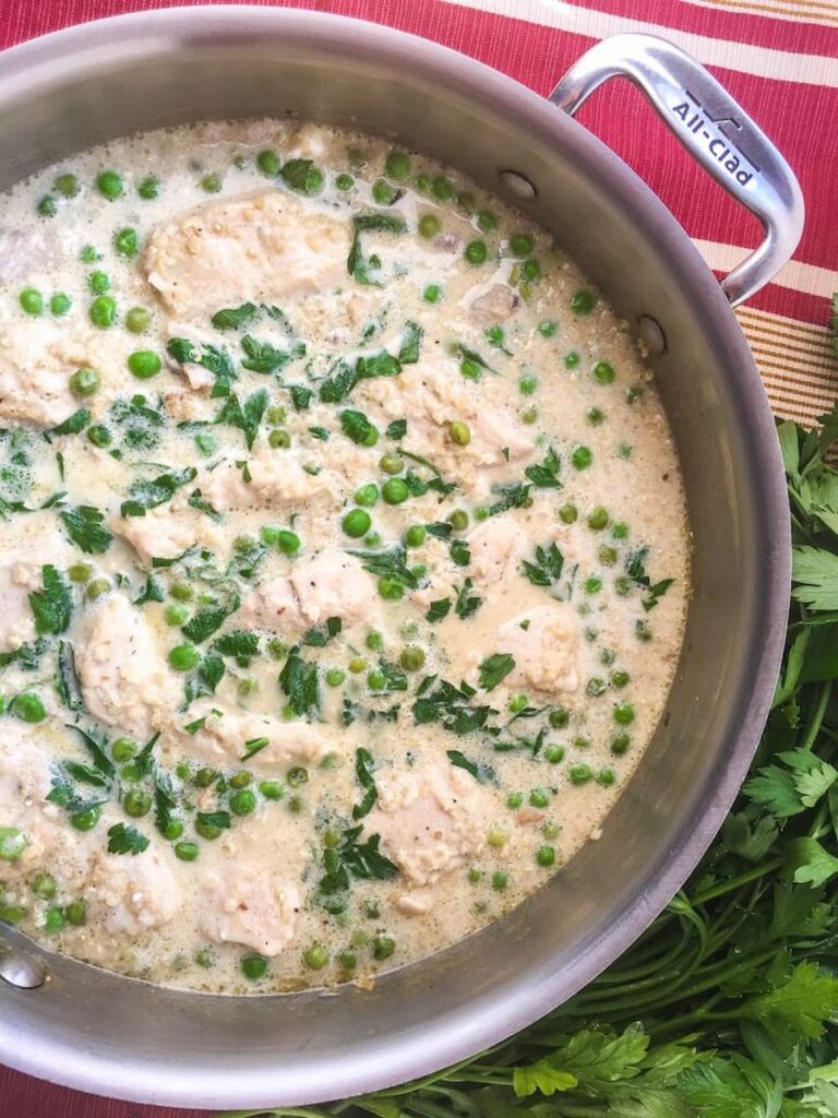 Chicken Quinoa and peas in a cooking pan.