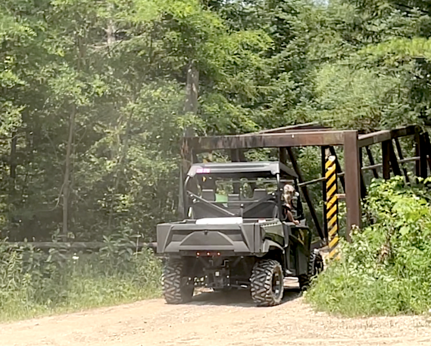 Getting ready to cross the metal bridge that spans the Manistee River - ORV Trails Cadillac