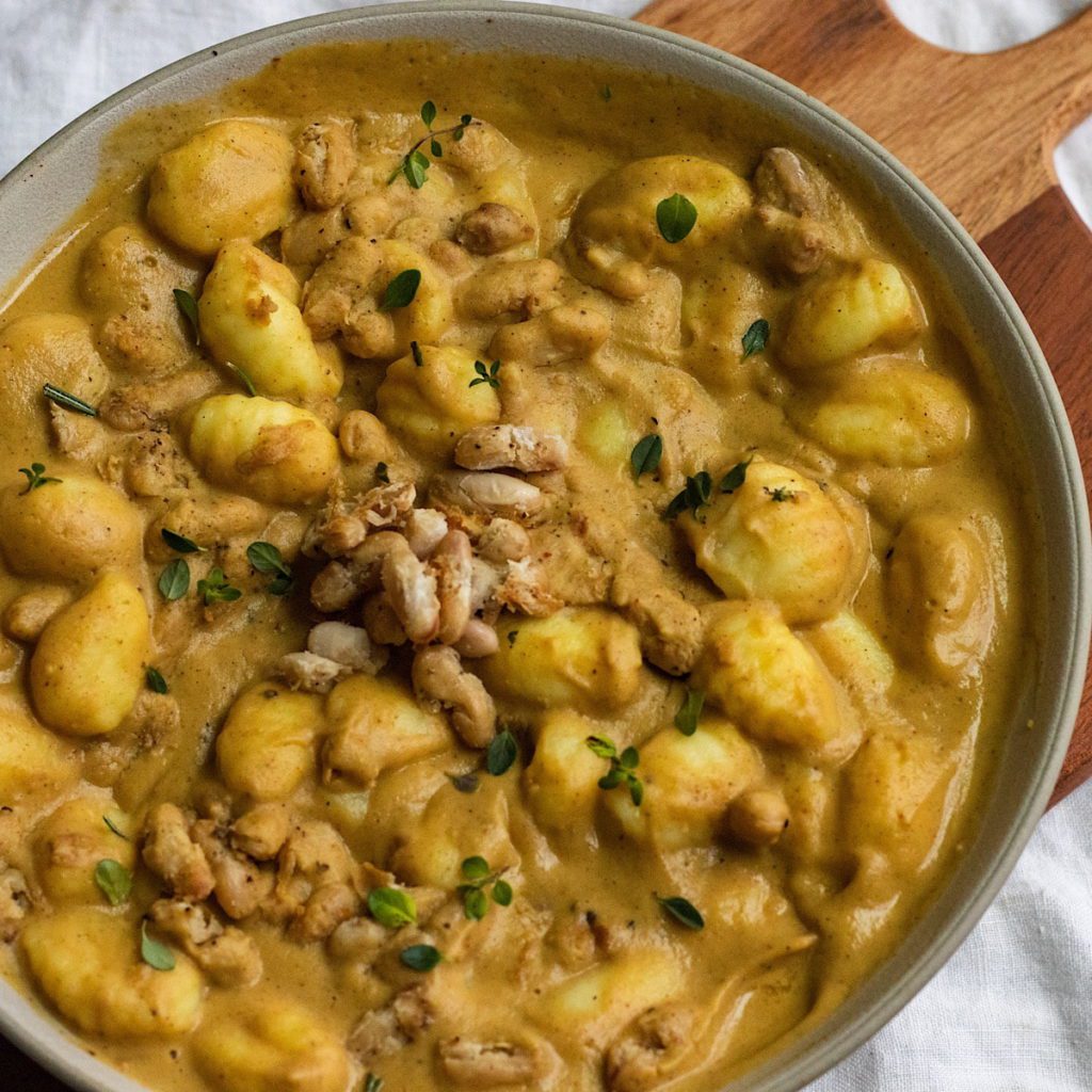 Creamy Acorn Squash Gnocchi Pasta With Crispy White Beans.