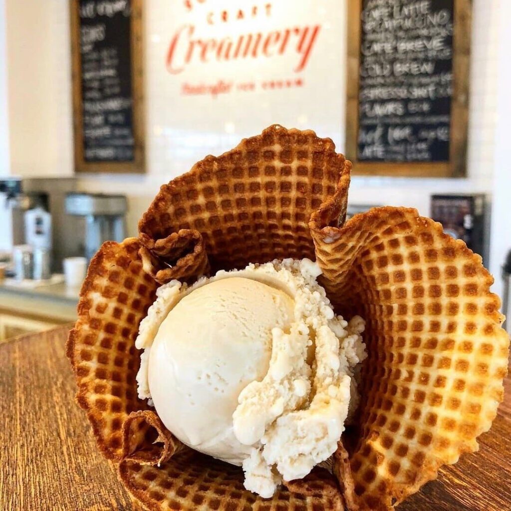 Scoop of Vanilla ice cream in a waffle cone at Southern Craft Creamery.