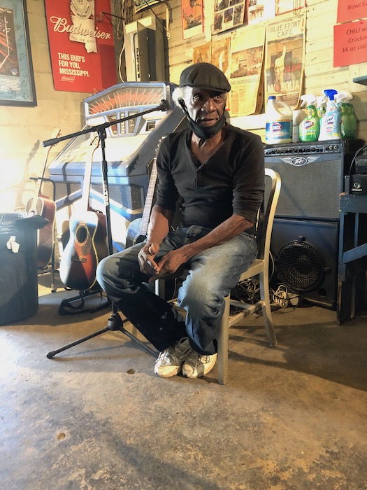 Jimmie Duck Holmes sitting inside the Blue Front Cafe