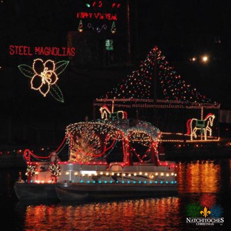 Natchitoches Christmas Festival--boat draped in christmas lights floating on the cane river.