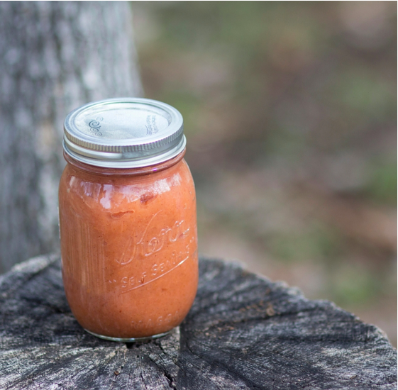 homemade applesauce in a pint jar.