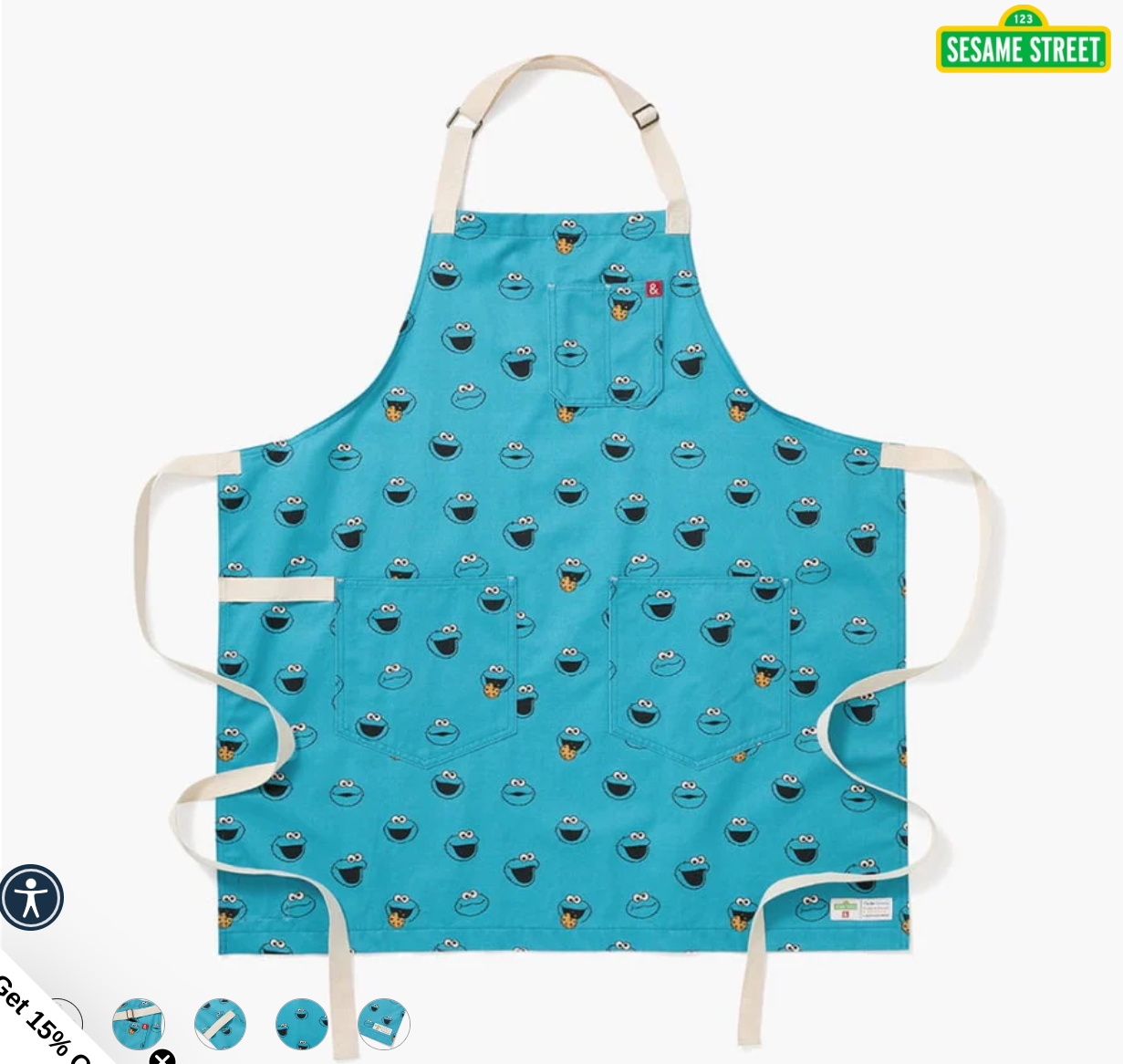 Photo Of a Blue Apron with the cookie monster all over it.