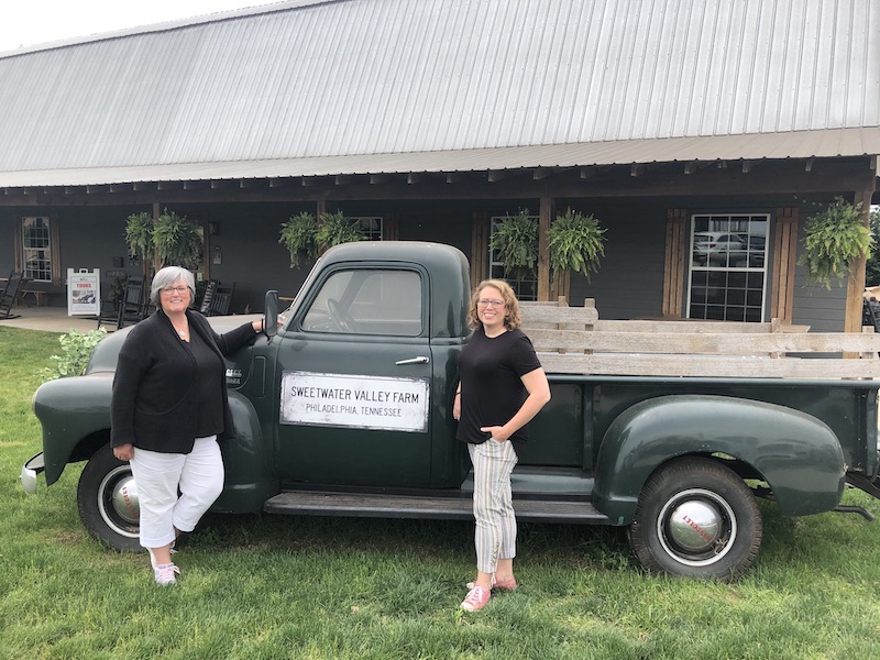 Laura and I standing in front of the vintage sweetwater valley farm truck