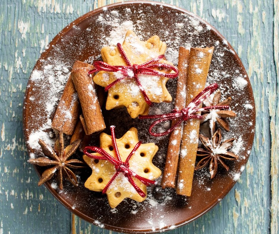 snowflake christmas cookies and cinnamon sticks