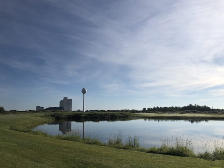 golf course with building in the background 2