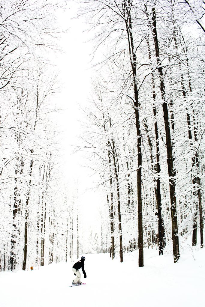 Photo of a person snowboarding.