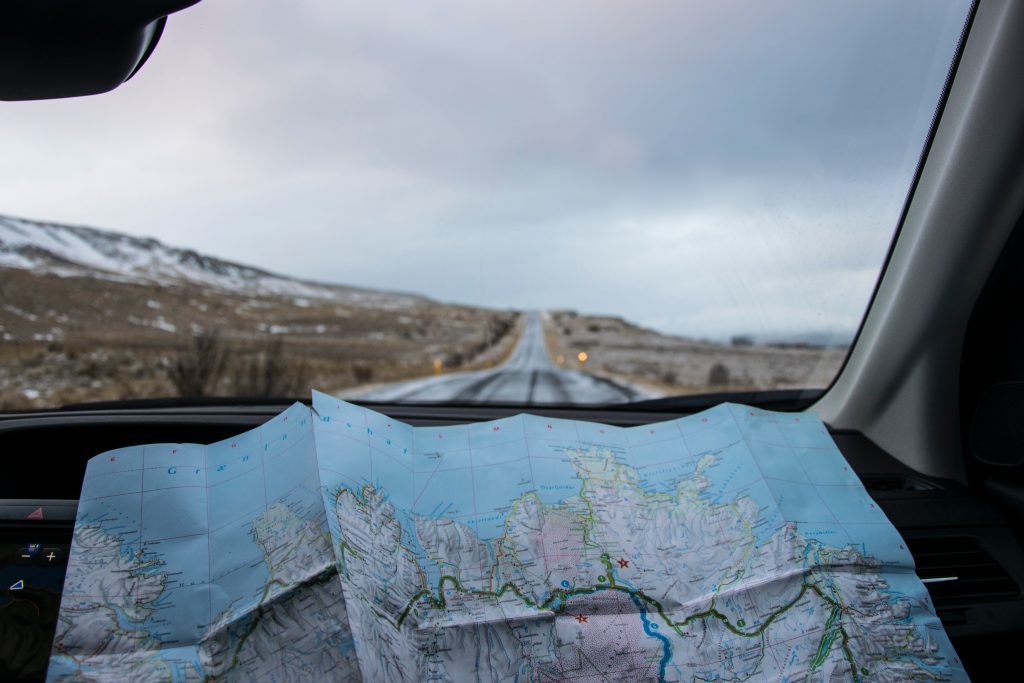 budget road trip guide using a map