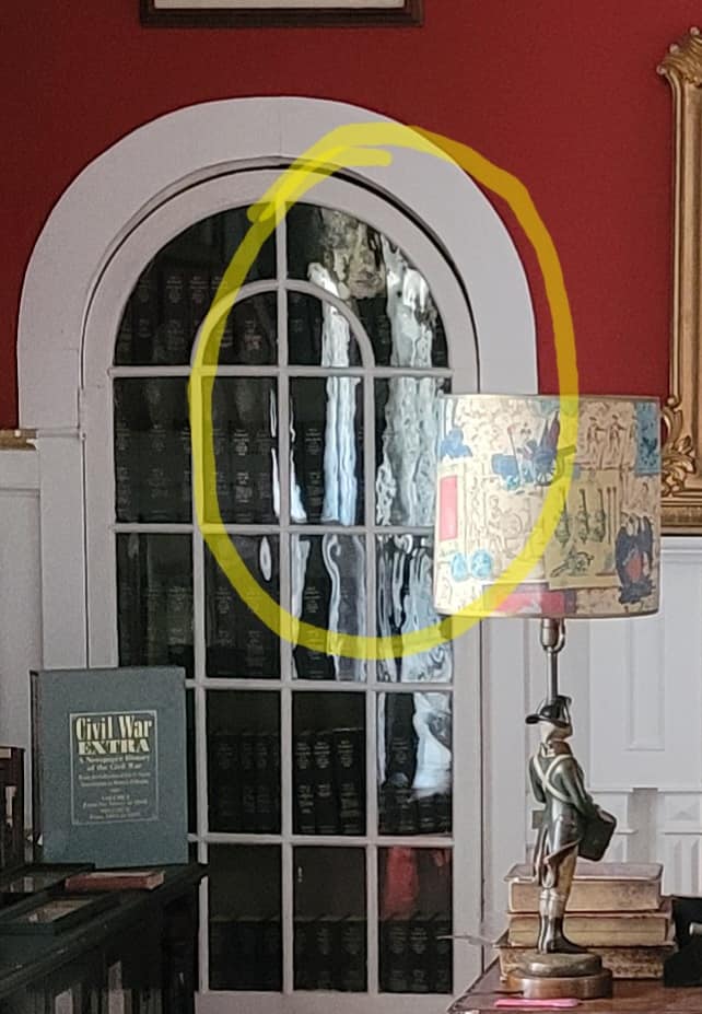 tri state paranormal reserch team, face reflected in glass (c) Amy Nortum